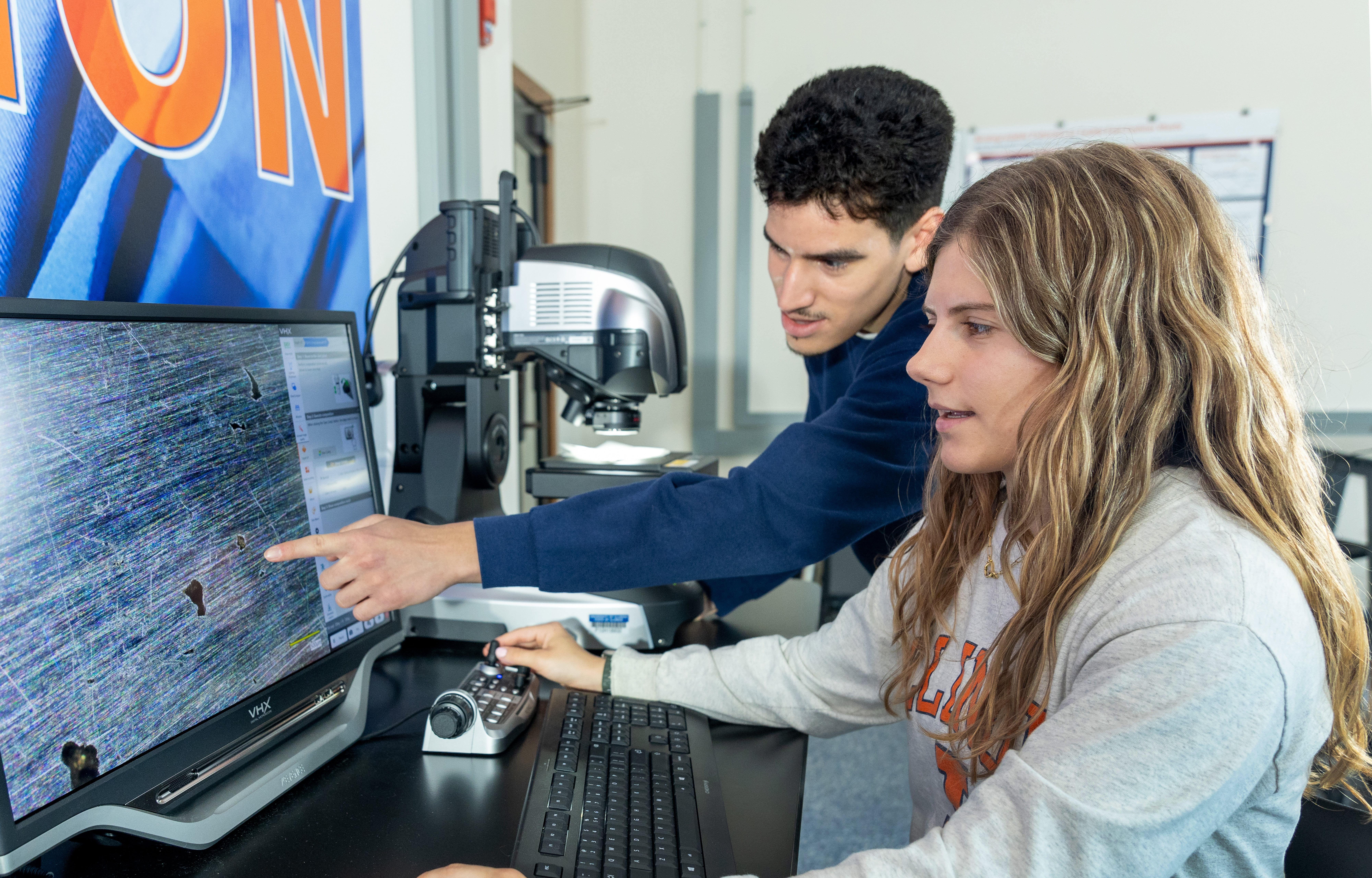Pictured: Two students using the Eltoukhy Family Innovation Lab space.