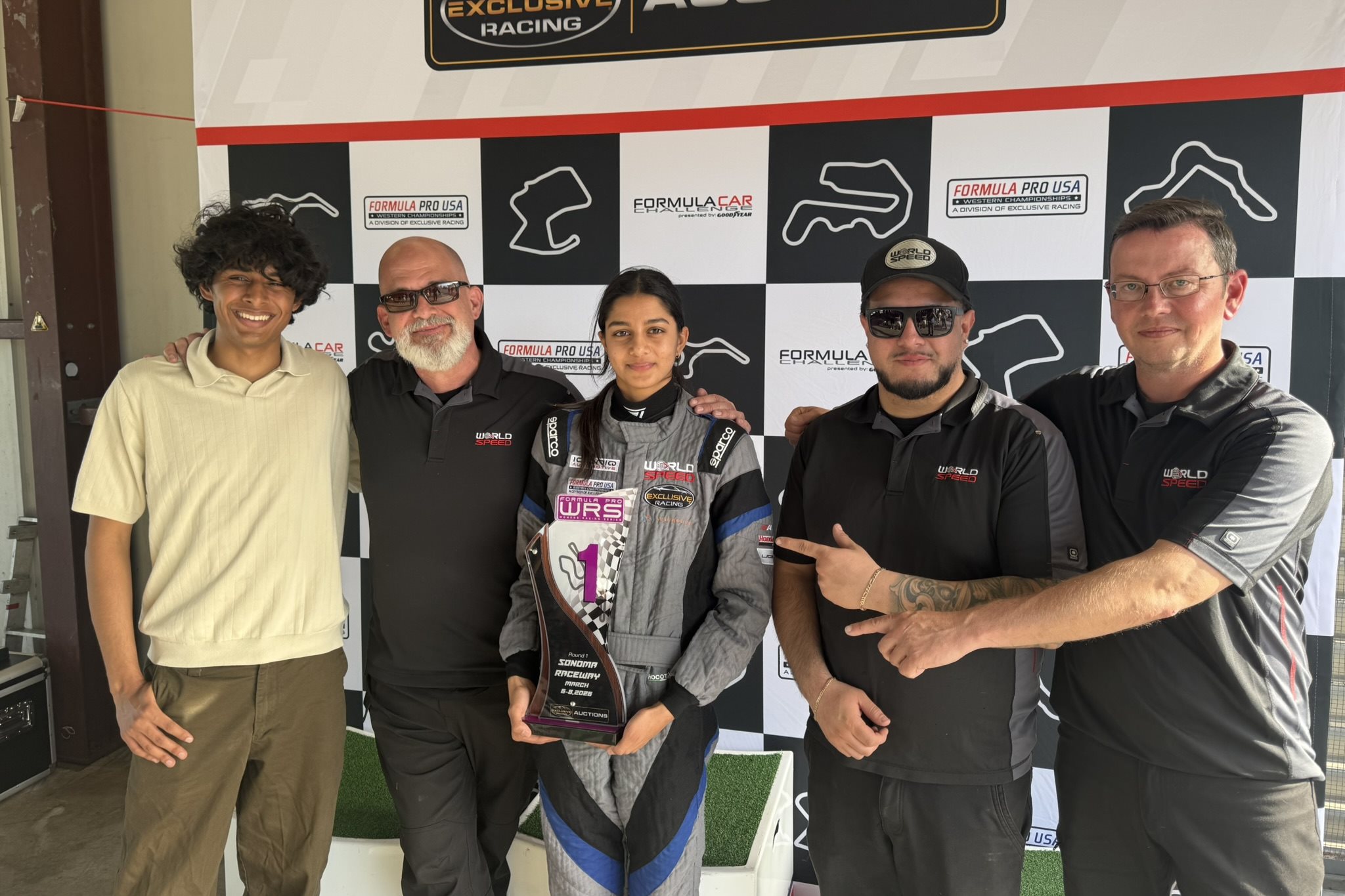 Yana Kapoor holding a championship WRS trophy.