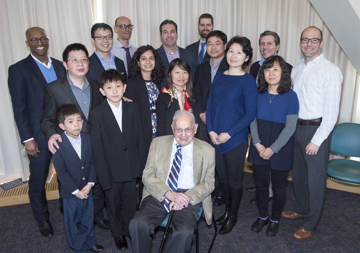 James Economy is surrounded by former students and their children during his 90th birthday celebration in April 2019.