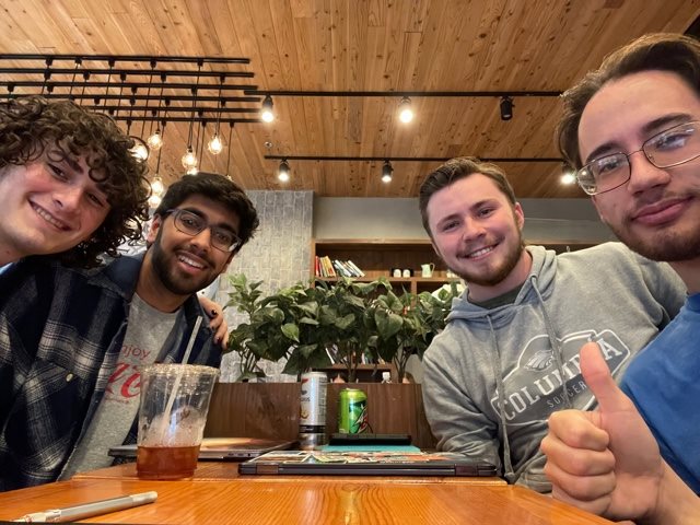 Shivam Tailor, second from left, enjoys quality time with his mentorship pod including undergraduate students, Adam Slafsky, left, Peter Gutknecht, third from left, and James Heaton at Caff&eacute; Bene in Urbana, Ill. on Nov. 10. Mentorship pod meetings encourage connections between freshman and upperclassmen.