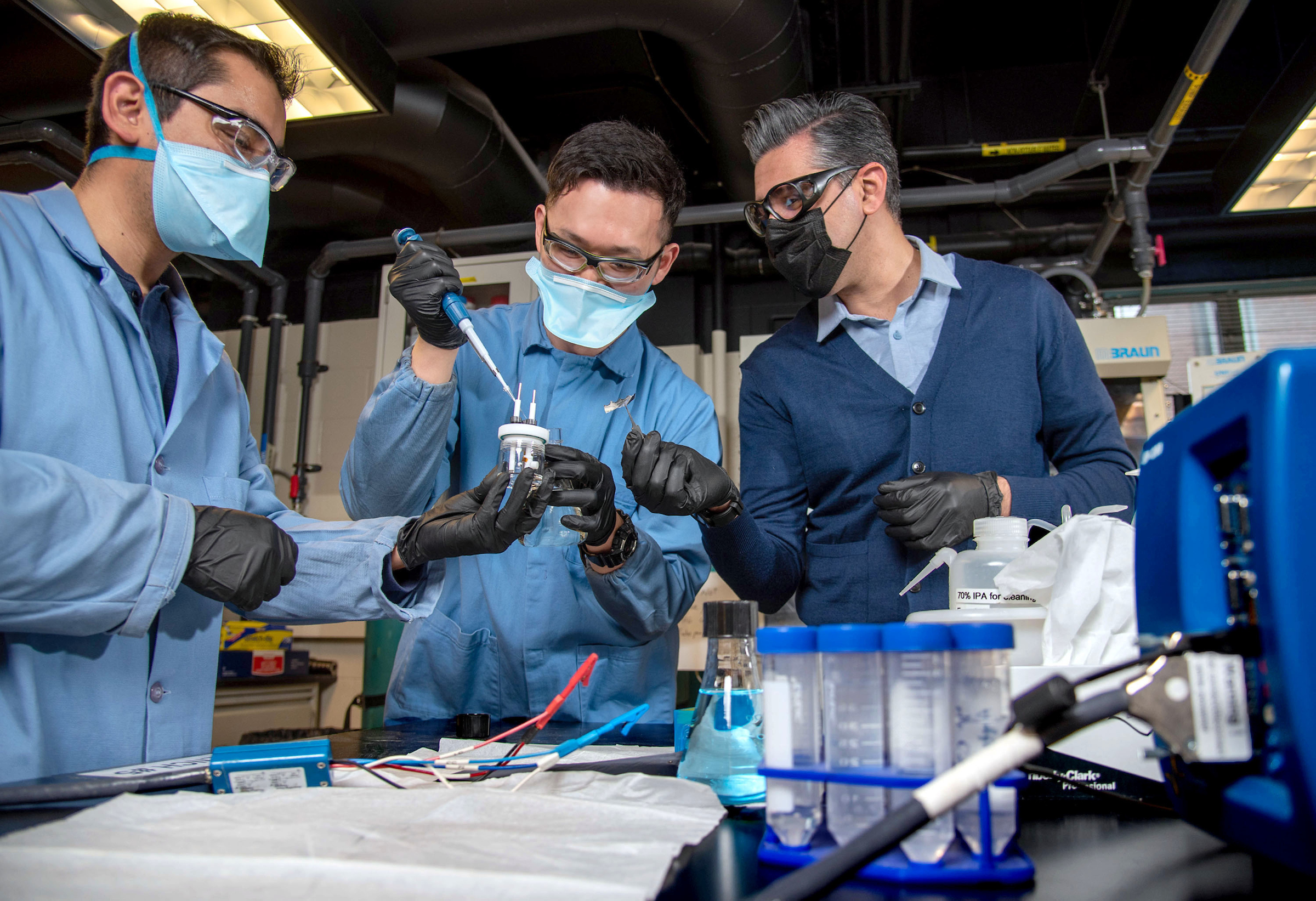 Beniamin Zahiri, right, works with graduate students Patrick Kwon, left and Carlos Juarez-Yescas in the lithium extraction process for their team efforts &nbsp; at the Engineering Sciences Building in Urbana, Ill. on Feb. 23, 2022. SelectPureLi has been selected as one of 15 semifinalists.&lt;br /&gt;&ldquo;I hope we are able to showcase how materials&rsquo; properties can be re-applied to the new problems the world is facing because of the impact of climate change,&rdquo; Zahiri said.