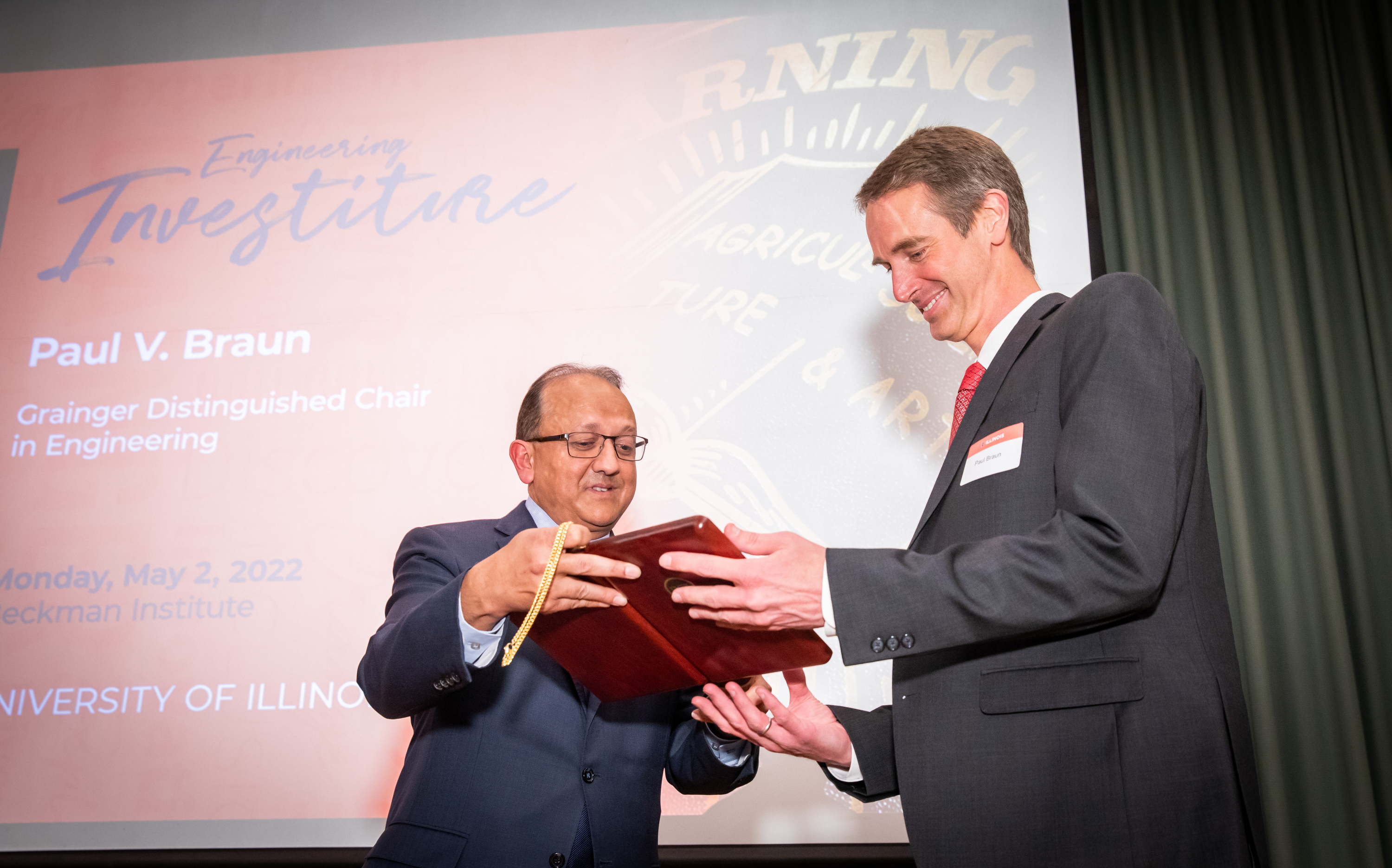 Fred Zwicky/Illinois News Bureau<br>Dean Rashid Bashir awards Paul Braun his medallion for his investiture as the Grainger Distinguished Chair in Engineering at the Beckman Institute in Urbana, Ill. on May 2.<br><br>"It's just been really wonderful to be able to work with professor Paul Braun for many years now," Bashir said. "I've looked up to his research group. I've looked up to really everything he does, and the way he does it in an extremely collegial way. He's certainly such a model researcher and a model scholar, and I think it's faculty like him and others that'll be recognized today that really make our material science and engineering department what it is &mdash; a world-class engineering department."