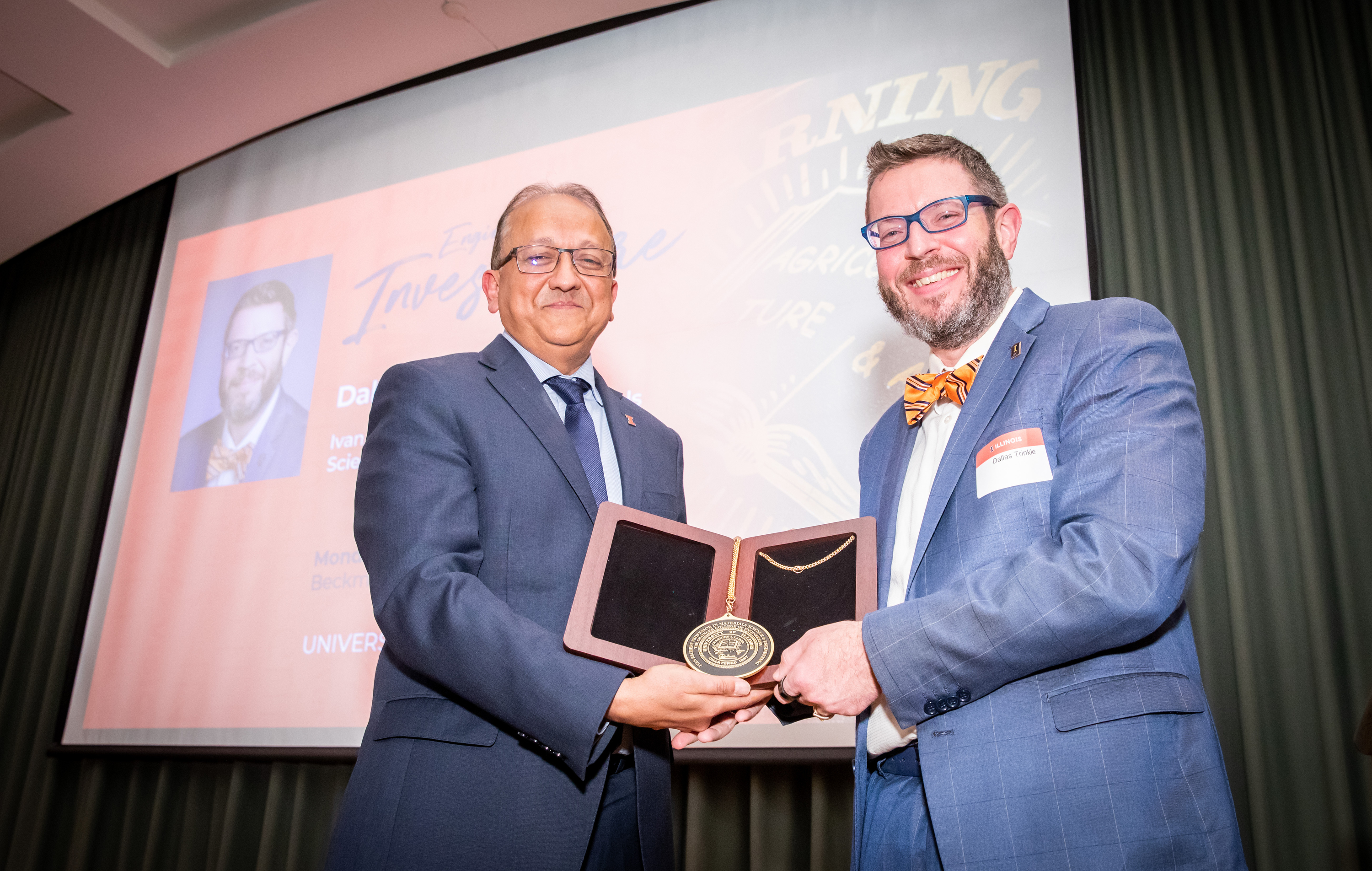 Fred Zwicky/Illinois News Bureau<br>Dean Rashid Bashir, left, presents Dallas Trinkle his award for his investiture as the Ivan Racheff Professor in Materials Science and Engineering at the Beckman Institute in Urbana, Ill. on May 2.<br><br>"This department is full of superstars," Bashir said. "We just expect no less but that continuous stardom, especially, of course, as it comes to scholarship, excellence, impact. I'm just so proud to be the dean of this college that has this Department of Material Science and Engineering."