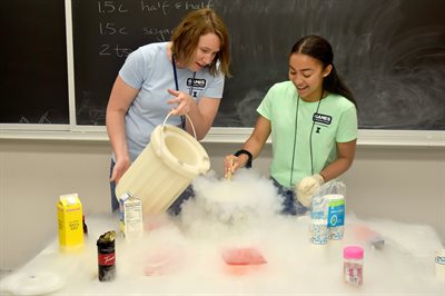 Eli Schuster/University of Illinois Urbana-Champaign alumnus&amp;amp;amp;lt;br&amp;amp;amp;gt;Jessica Krogstad, left, camp coordinator, has fun with dry ice alongside a GLAM (Girls Learning About Materials Science) camper in June 2018 in the former space used by the camp. The Eltoukhy Innovation Lab makes way for outreach events like STEM summer camps, where junior high and high school students can explore what material science&amp;amp;amp;amp;nbsp;and engineering is all about at the U of I campus.