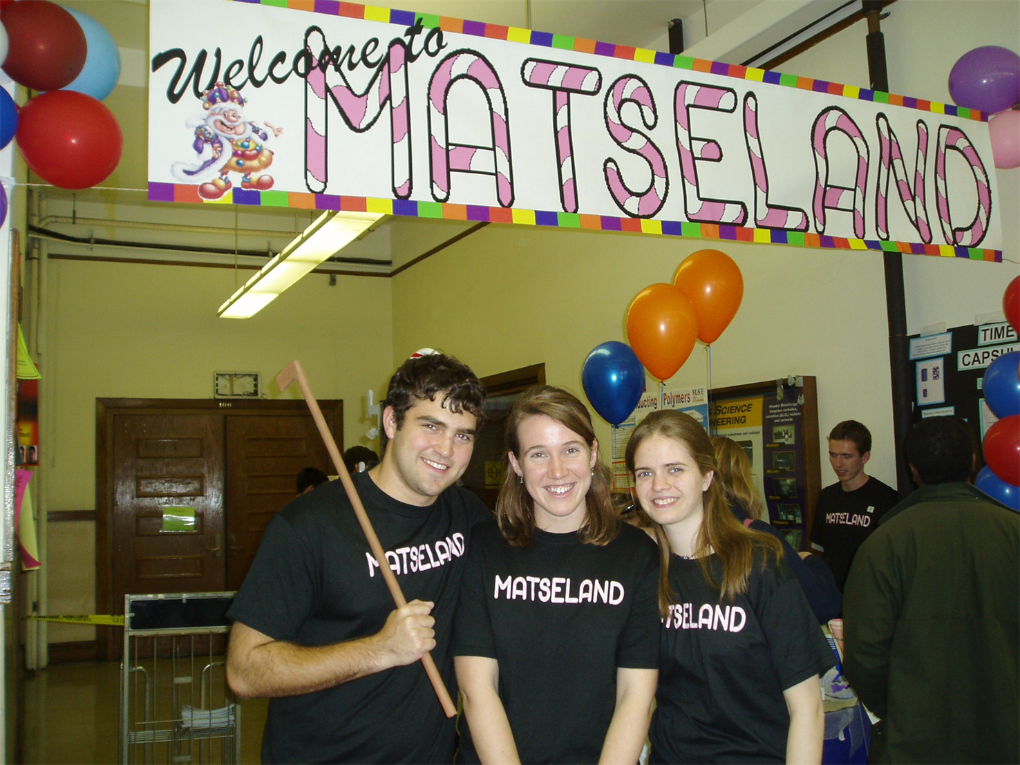 Marie Mayer, right, is all smiles with classmates Daniel Krogstad, left and Jessica Krogstad during MatSE's Candyland-themed Engineering Open House exhibit called MatSEland. Daniel and Jessica Krogstad now serve as MatSE's research assistant professor and associate professor, respectively.