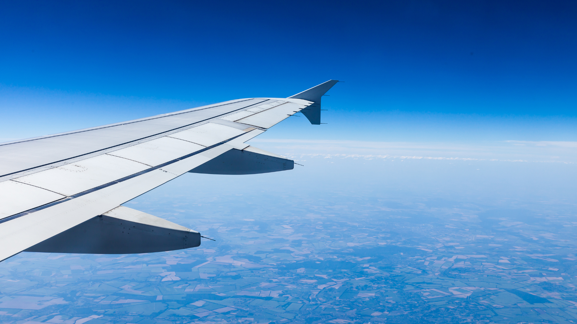 Airplane wing in the sky