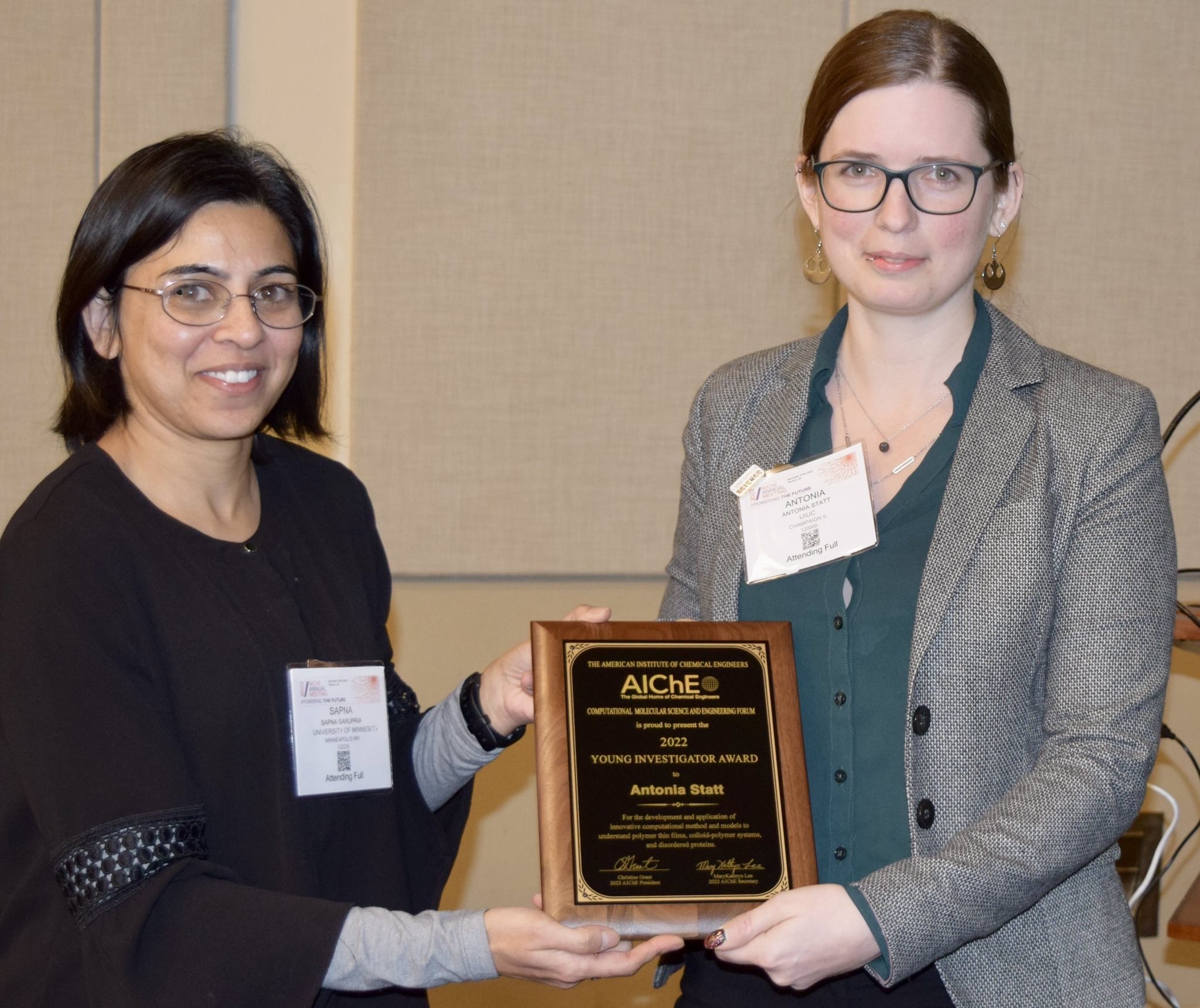 Sapna Sarupria, associate professor of the University of Minnesota&amp;rsquo;s Department of Chemistry, left, presents Antonia&amp;nbsp;Statt, a MatSE assistant professor, the 2022 CoMSEF Young Investigator award at the Phoenix Convention Center in Phoenix, Ariz, on Nov. 16.