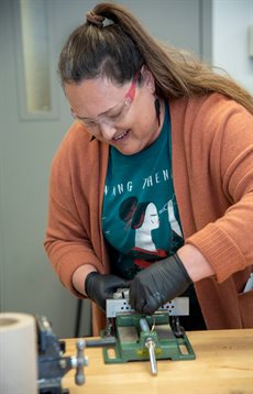 Amy Truemper, a middle school teacher from Aurora, Ill., learns materials science experiments that connect to real-life scenarios during the ASM Materials Camp last summer.