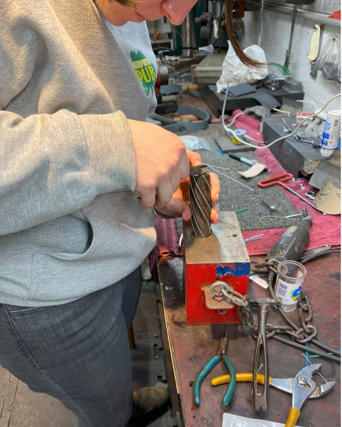 MatSE junior Kira Martin shapes the blade's handle at the Andersen Forge workshop in&amp;amp;nbsp;Watseka, Ill.