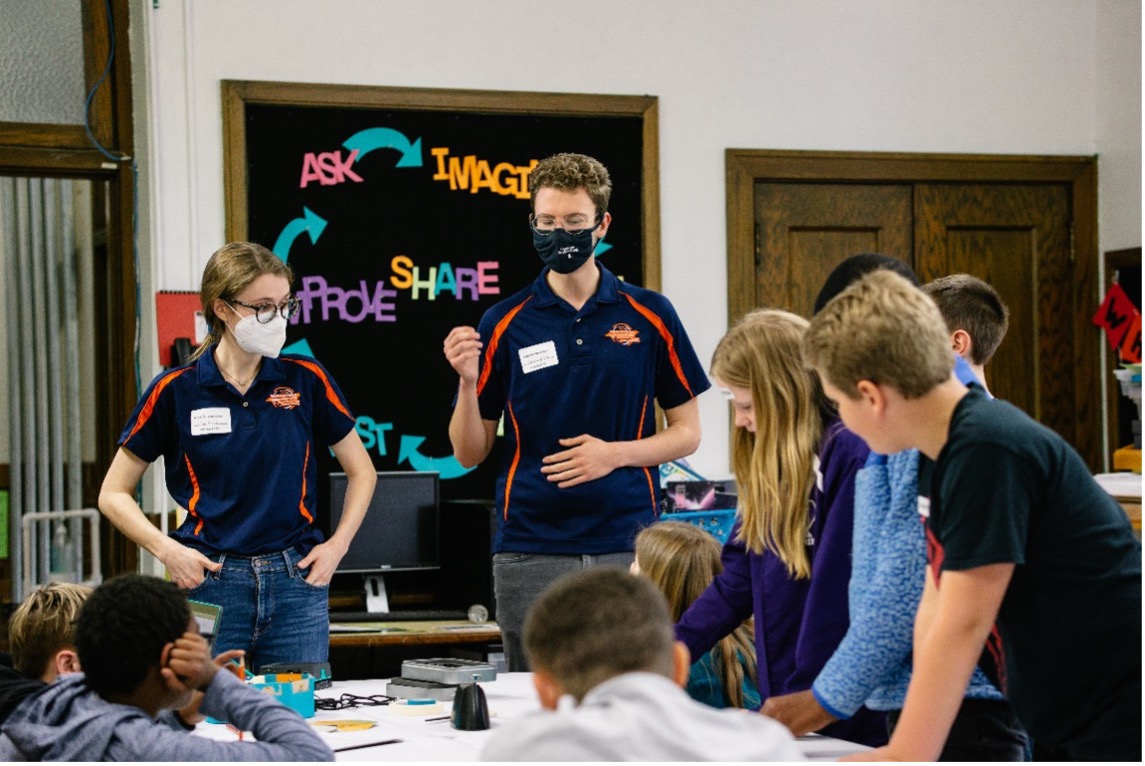 Engineering Ambassadors Sara Pfeil (MatSE) and Kevin Lyvers (ECE) lead sixth-grade students in an electronics and coding activity at Judah Christian School in Champaign, Ill. in April 2022.