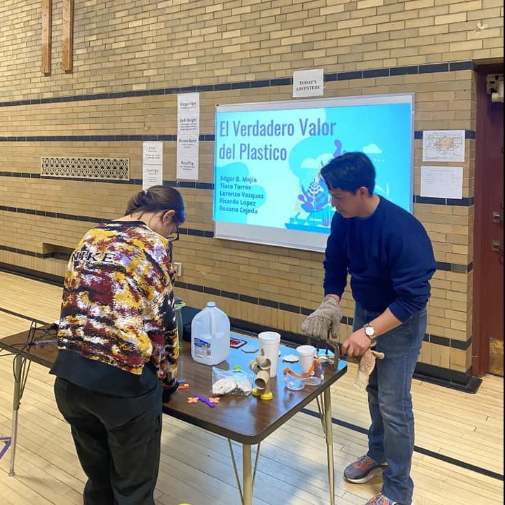 Illinois grad students Tiara Torres Flores (CheBE) and Edgar Mejia prep for their workshop with Cena y Ciencias at Leal Elementary School in Urbana, Ill.