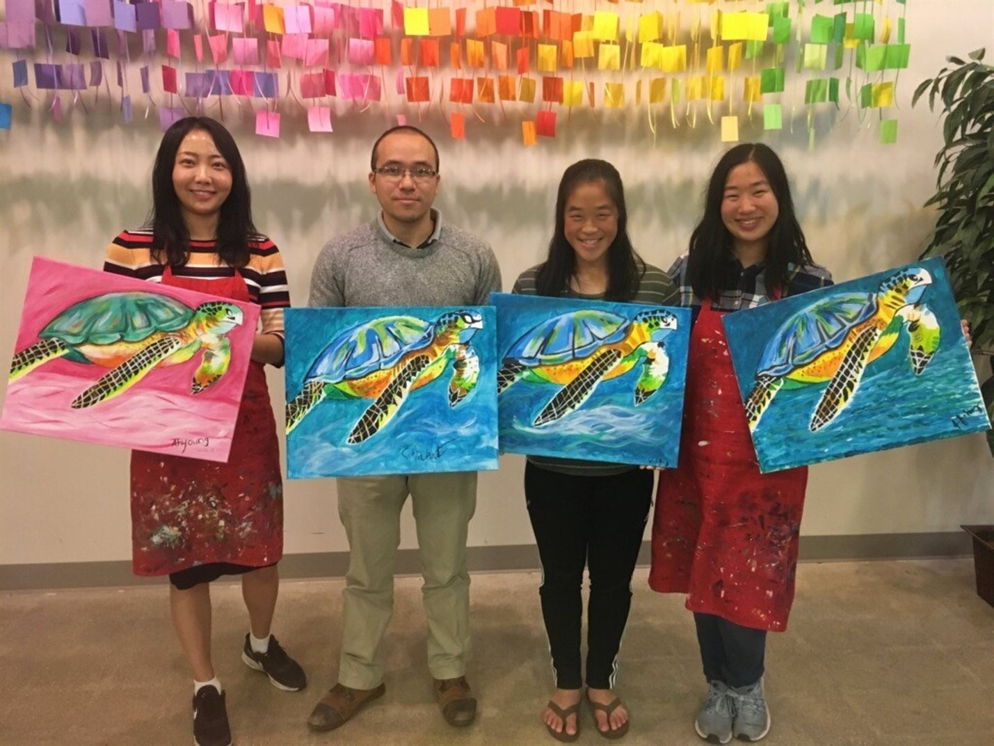 Ahyoung Kim (left) is all smiles while showing off her artwork alongside her friends she met during her time in MatSE's&nbsp; Graduate Program during a paint night. Pictured, from left, are: Ahyoung Kim, Sushant Mahat, Sherly Huang and Jennifer Huang.