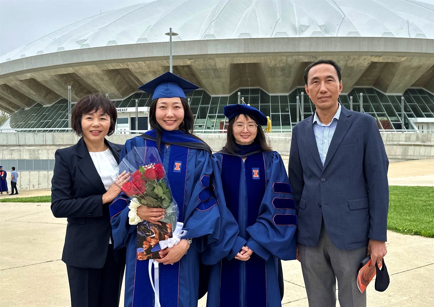 Ahyoung Kim (second from left) poses with her doctoral advisor, associate professor Qian Chen (second from right), and her mom (left) and dad (right).