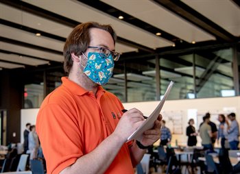 MatSE Senior Design course instructor Matt Goodman listens to a project presentation during the annual presentation day held at the Campus Instructional Facility in Urbana, Ill. on May 5.