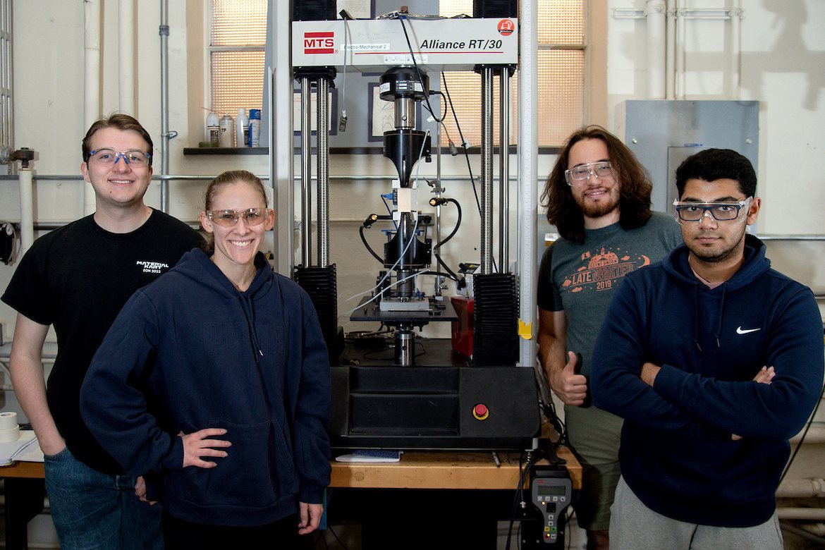 Members of the material improvement of athletic tape Senior Design team conduct analysis on their athletic tape in the Talbot Lab in Urbana, Ill. earlier in April. Pictured, from left, are: Steven Endres, Aleah Treiterer, James Heaton and Suhaas Reddy.