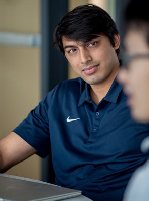 Atharva Atreya chats with his Senior Design teammates during the annual presentation day at the Campus Instructional Facility in Urbana, Ill. on May 5.