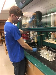 Man works with science equipment in a laboratory