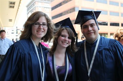 Isiah Ramos with two friends after graduation from the University of Illinois